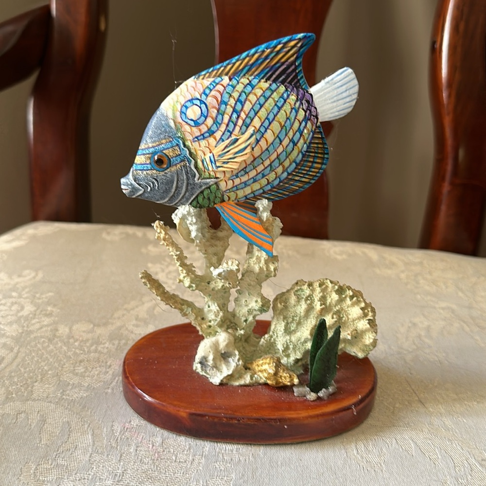 Beautiful handcrafted and painted wood tropical fish with coral and shells